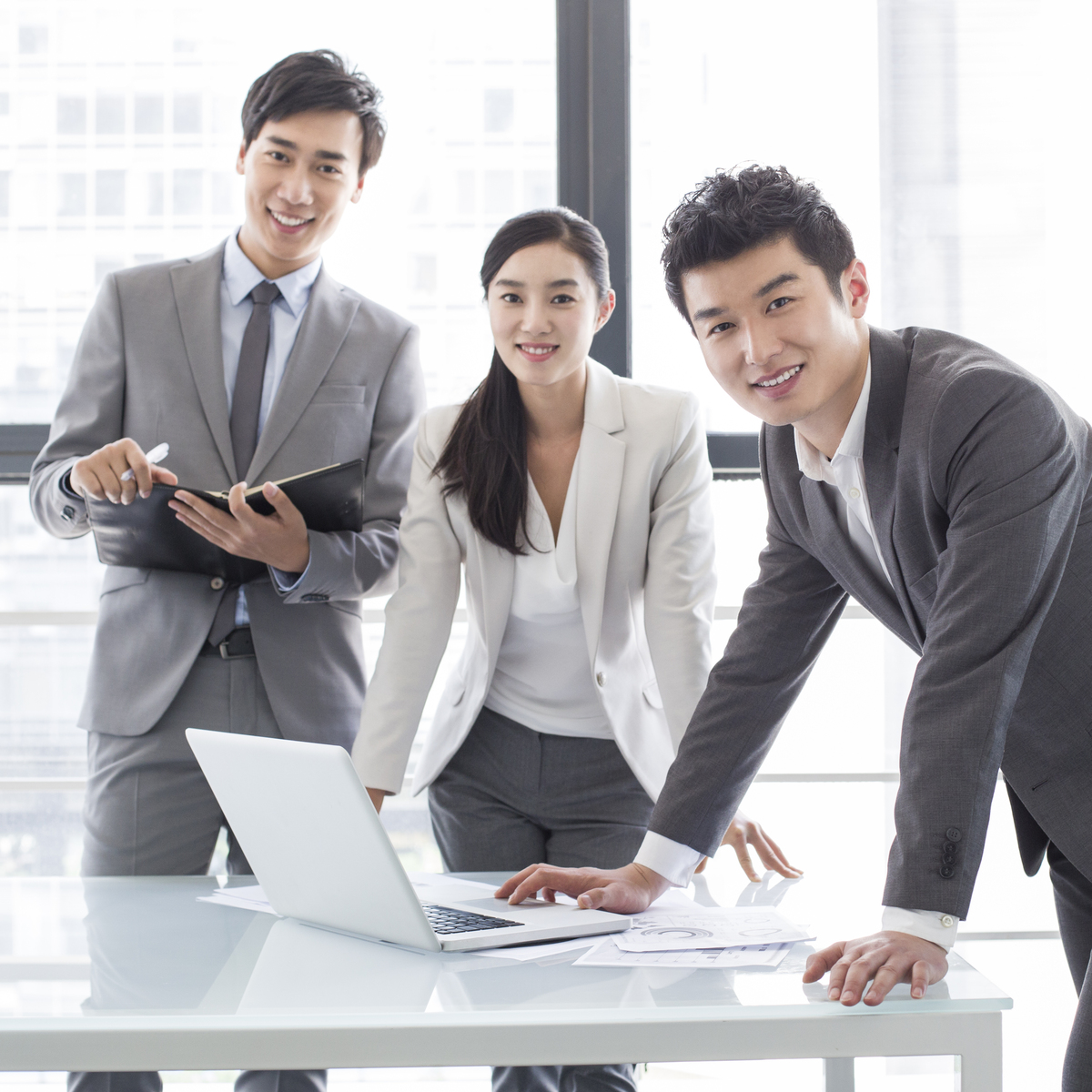 Young Chinese business person talking in meeting